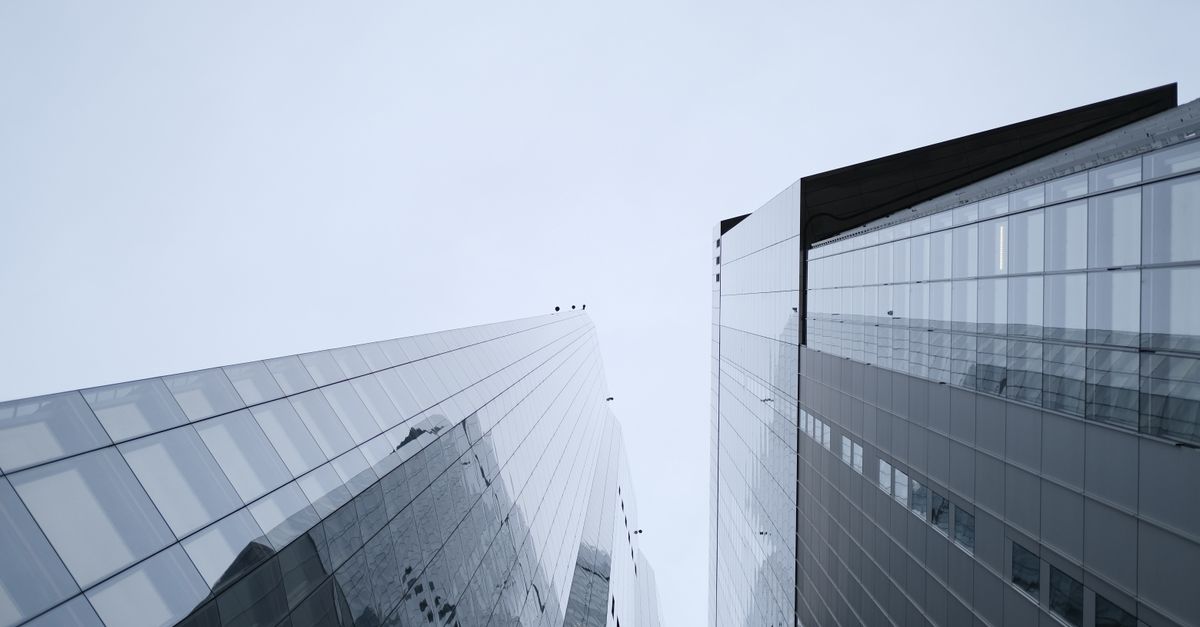 Corporate glass towers representing a holding structure